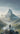 Photographie d'un randonneur devant une montagne